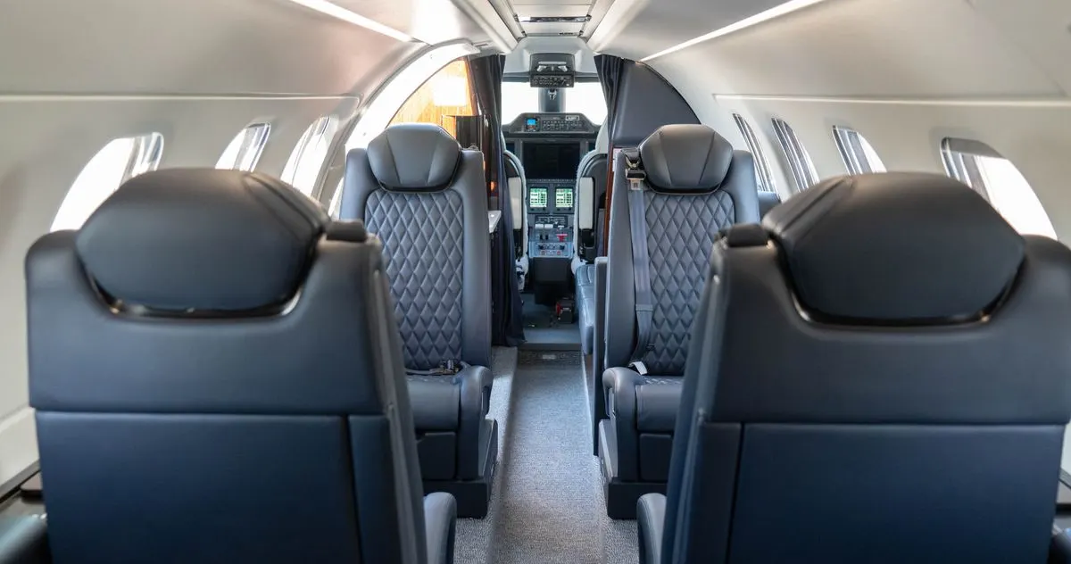 The leather seats and cabin of a private jet